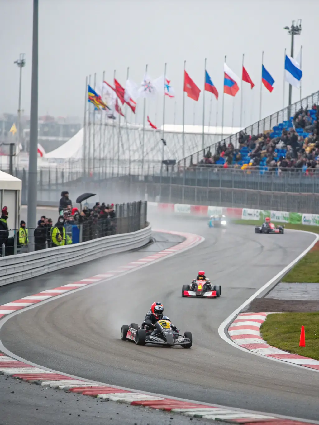 LES TOURISTES KARTING TEAM members participating in a local karting event, demonstrating the competitive aspect of the team's activities.